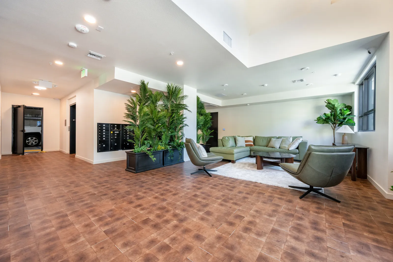 The Gramercy — lobby lounge with seating and greenery