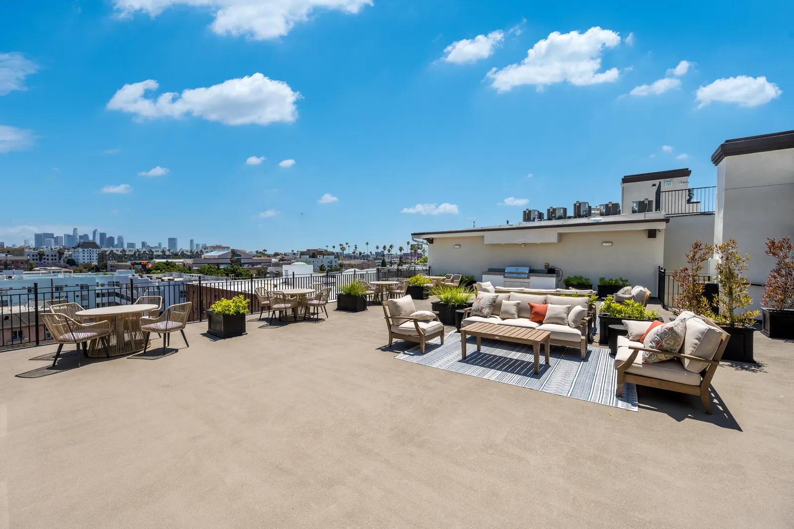 The Gramercy — rooftop deck with downtown LA skyline views