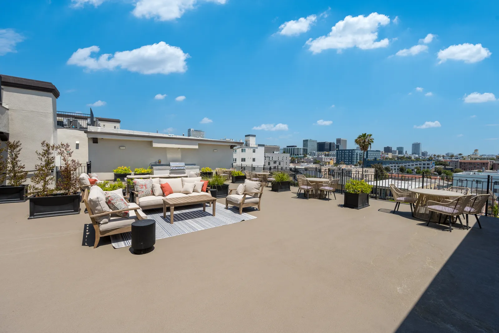 The Gramercy — rooftop lounge seating with city views